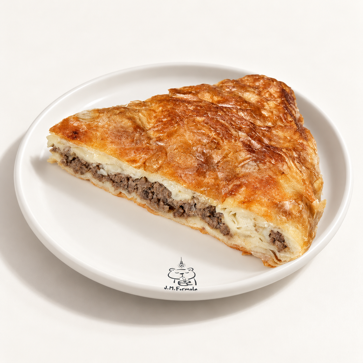 JM Formula Beef Burek with subtle JM Formula branding on an off-white background