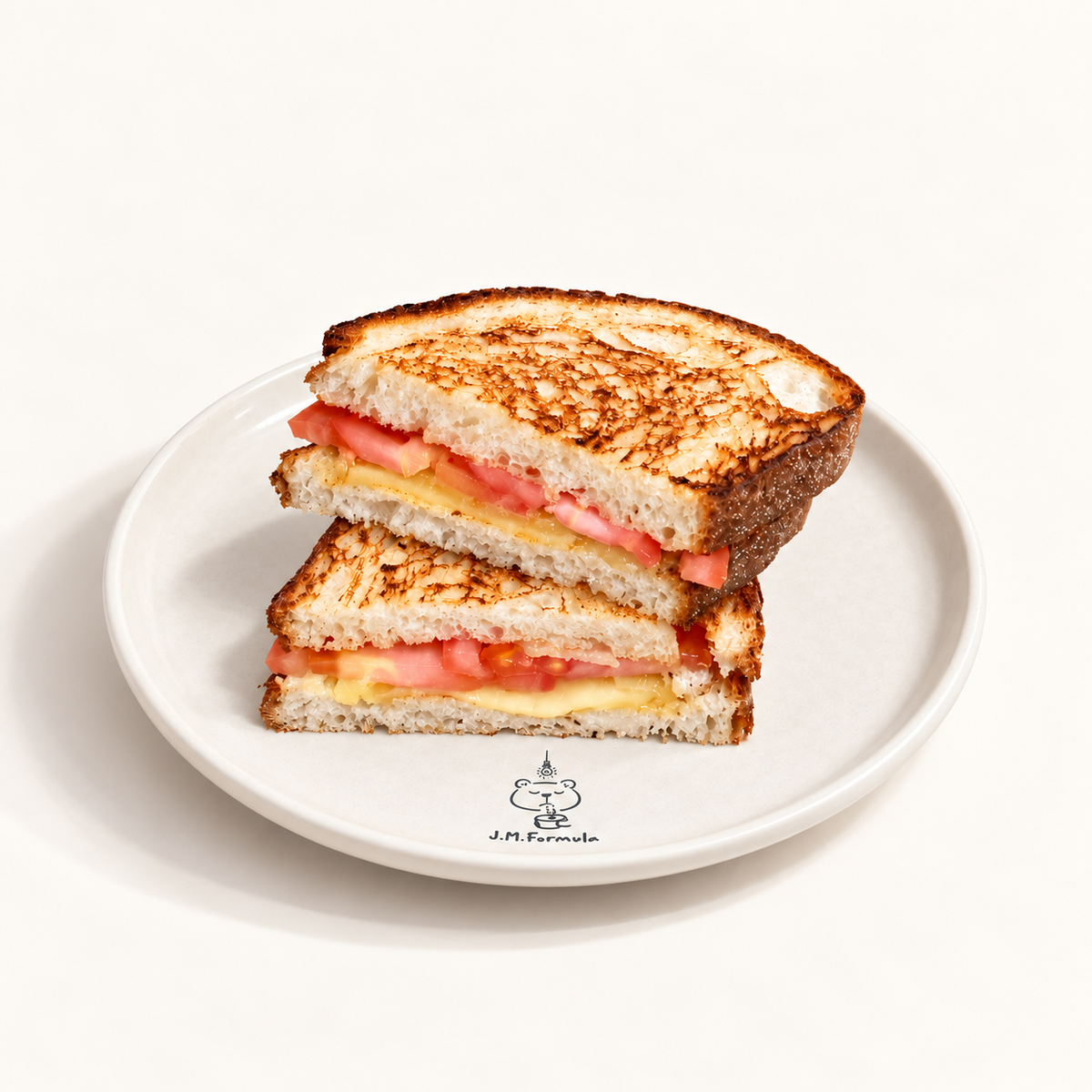 JM Formula Cheese & Tomato Toastie on an off-white background