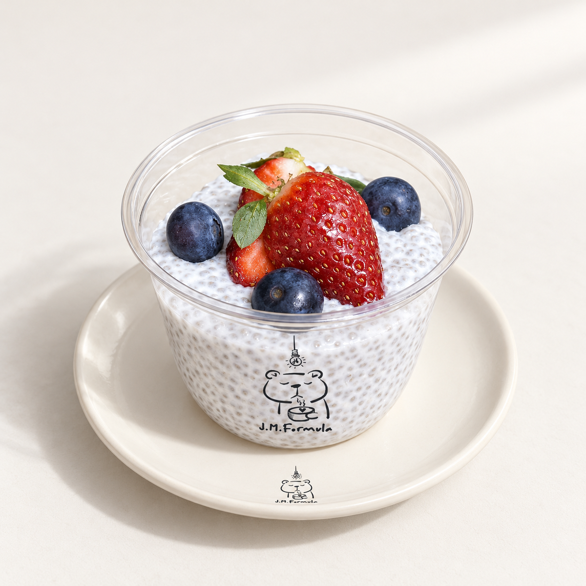 JM Formula Coconut Chia Pudding on an off-white background