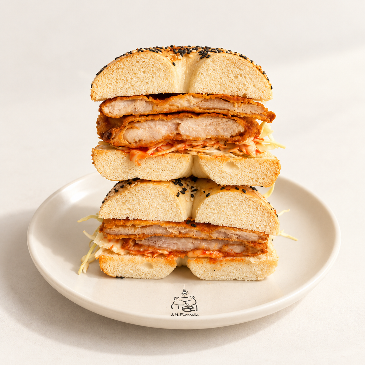 JM Formula Fried Chicken Bagel on an off-white background