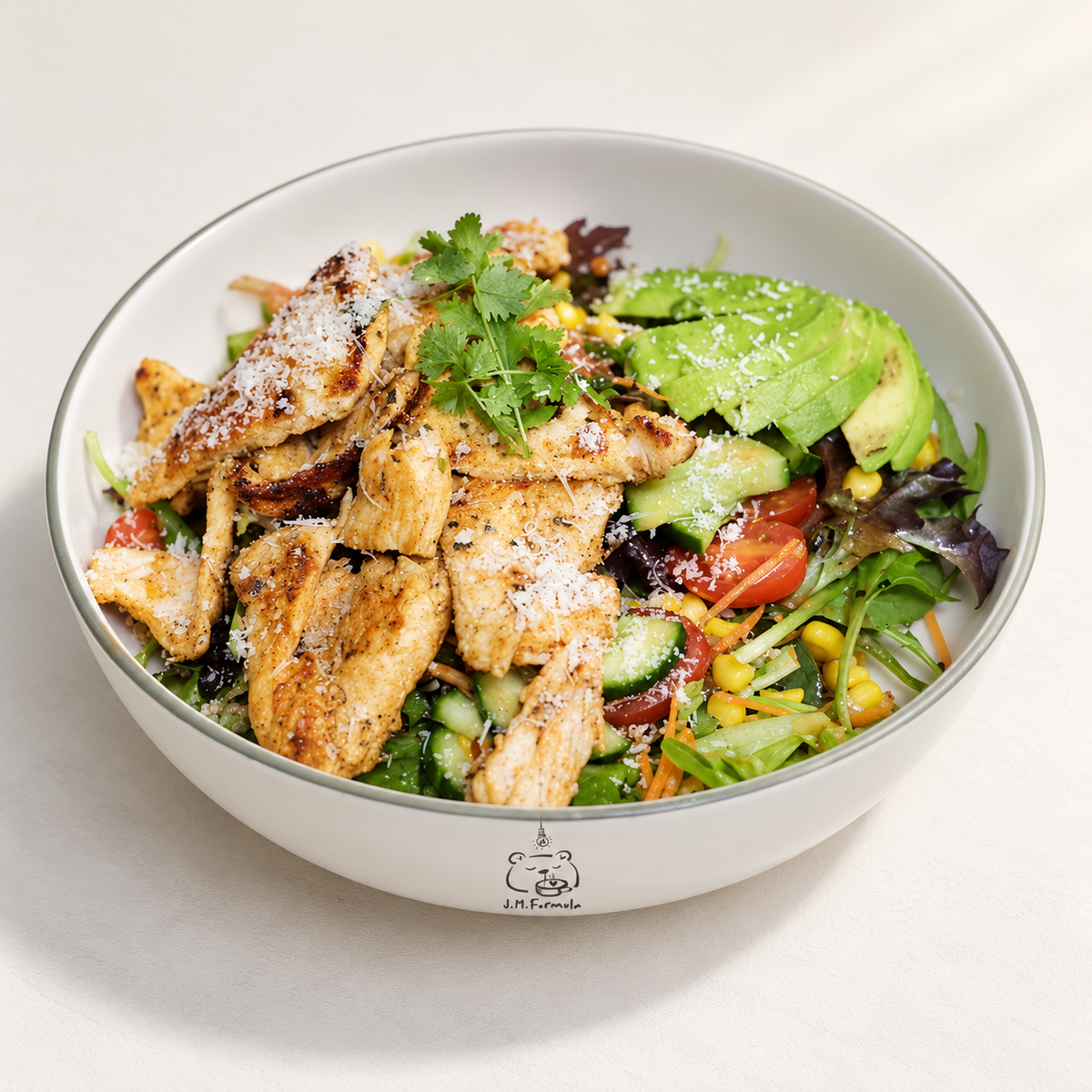 JM Formula Grilled Chicken Salad on an off-white background