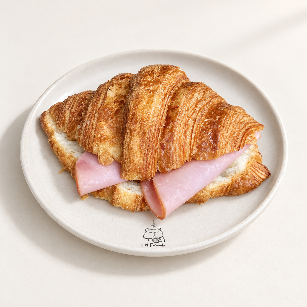 JM Formula Ham Croissant on an off-white background