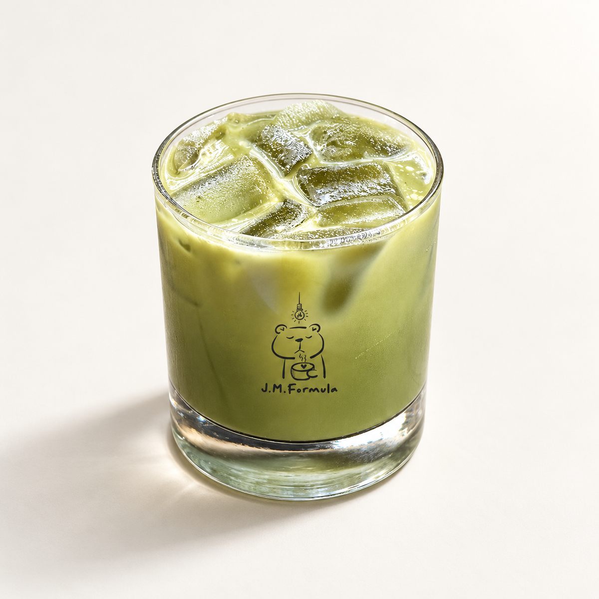 JM Formula Iced Matcha Latte on an off-white background