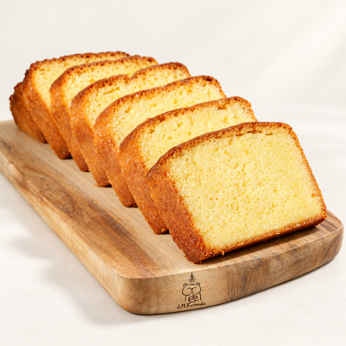 JM Formula Lemon Cake Loaf on an off-white background